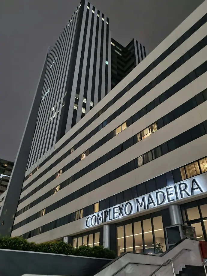 a very tall building with a clock on it's side